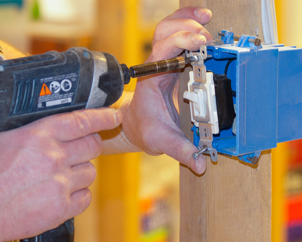 electrician working on light switch cedarburg wi